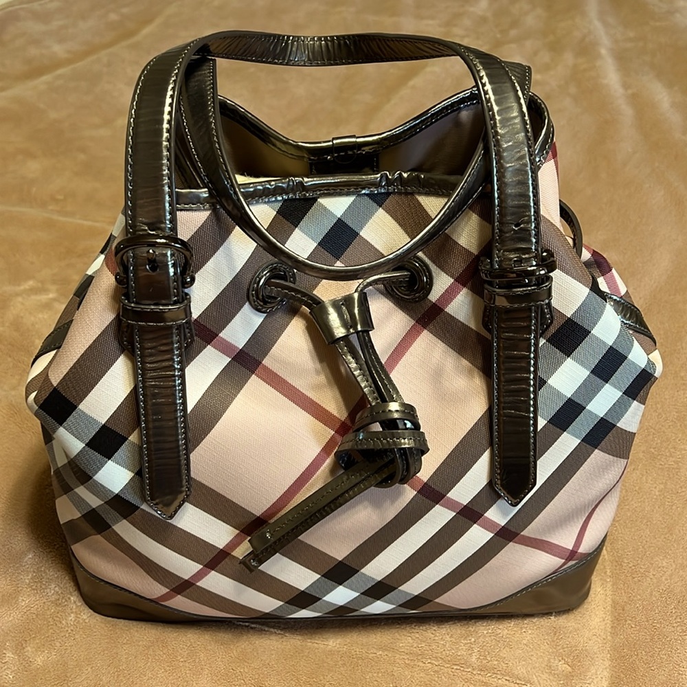 BURBERRY
Supernova Check Drawstring Tote Pewter leather trim